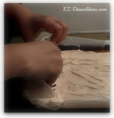 Hold on to the paper and start rolling this no-towel pumpkin roll Hold on to the paper and start rolling