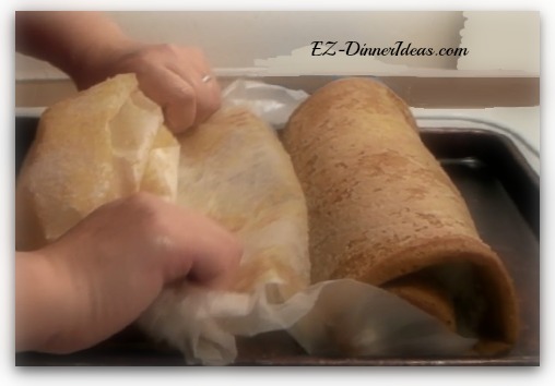As the cake roll gets to the end, the paper will completely peel off As the cake roll gets to the end, the paper will completely peel off