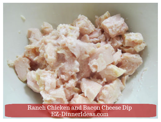 Canned chicken in mixing bowl