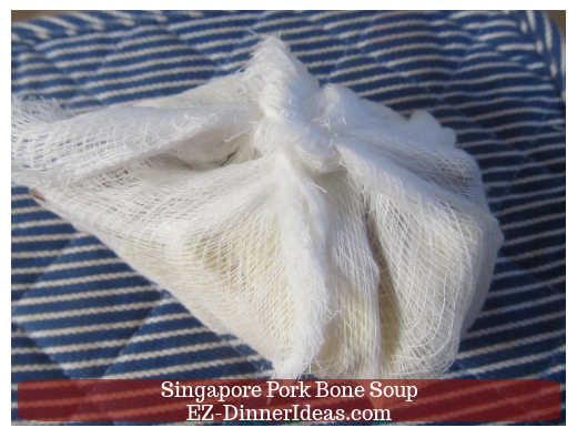 Garlics, start anise and cinnamon sticks wrapped in a pouch Garlics, start anise and cinnamon sticks wrapped in a pouch