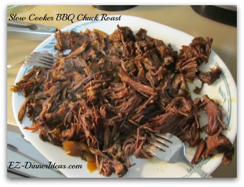 Slow Cooker BBQ Chuck Roast - Use 2 forks to shred the meat and transfer back to the slow cooker