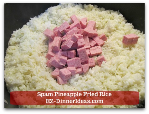 Hawaiian Fried Rice | Spam Pineapple Fried Rice - Push rice to the side and add diced Spam in the middle of the pan.