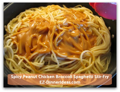 Spicy Peanut Chicken Broccoli Spaghetti Stir-Fry - Add spicy peanut sauce into pasta; toss to coat Spicy Peanut Chicken Broccoli Spaghetti Stir-Fry - Add spicy peanut sauce into pasta; toss to coat