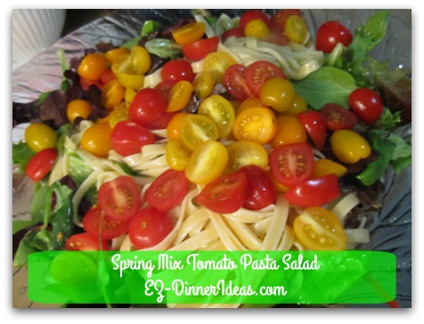 Spring Mix Tomato Pasta Salad - Top with grape tomatoes and serve immediately