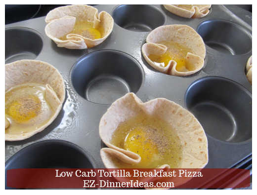 An egg is in each muffin tin cup An egg is in each muffin tin cup