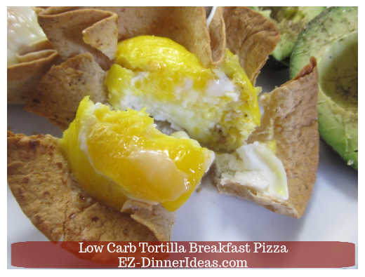 The inside of the single served breakfast pizza with slightly beaten egg The inside of the single served breakfast pizza with slightly beaten egg