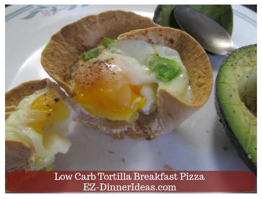 Single served breakfast pizza with scallions and a little runny yolk Single served breakfast pizza with scallions and a little runny yolk