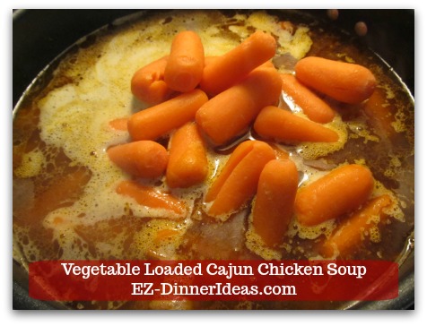 Kale Chicken Soup | Vegetable Loaded Cajun Chicken Soup - Add baby carrots and cook at low boil for 20 minutes.