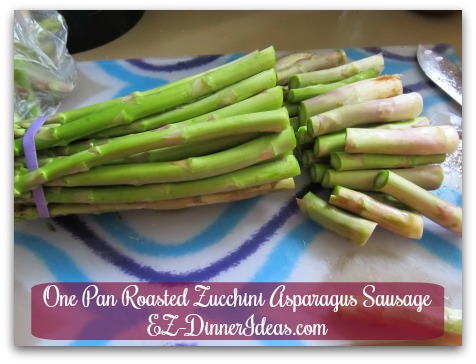 One Pan Roasted Zucchini Asparagus Sausage - Cut and discard the tough part of the asparagus